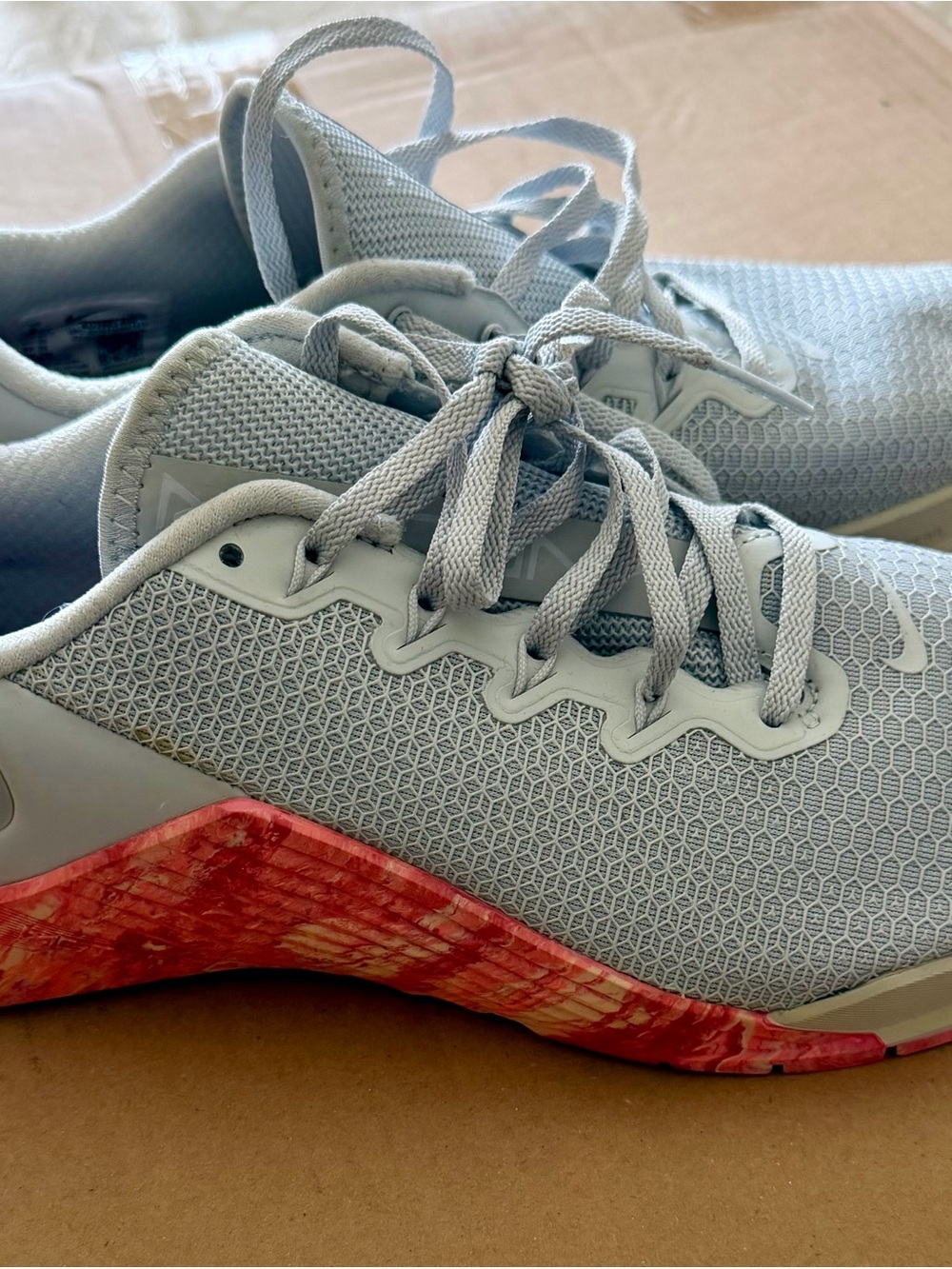 Nike Women's Light Gray Athletic Sneakers with Coral-Red Accent